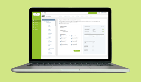 Laptop auf grünem Hintergrund mit GebäudeCheck